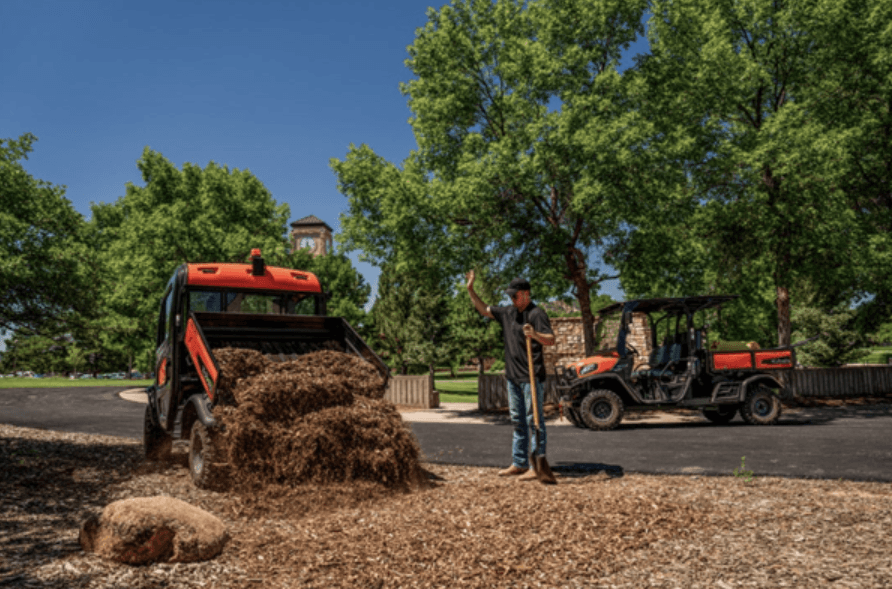 RTV dumping dirt onto pile