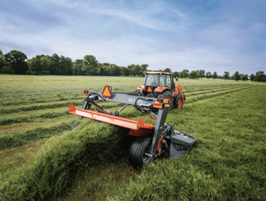 Tractor pulling a disc mower